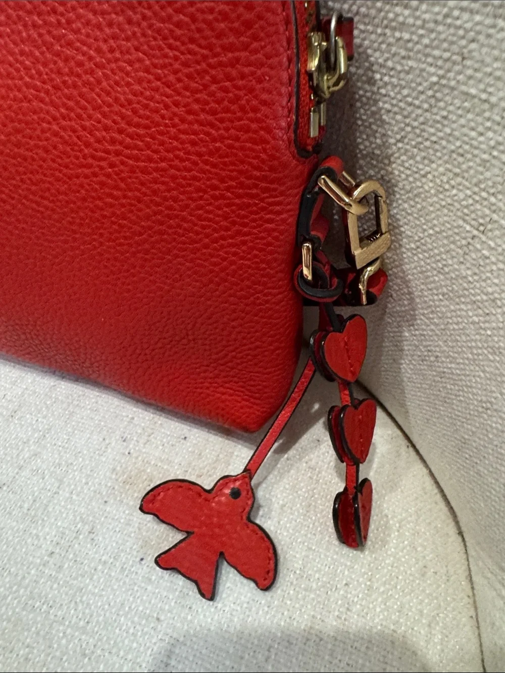 Tory Burch Red-Orange Pebbled Leather Crossbody with Heart Tassel